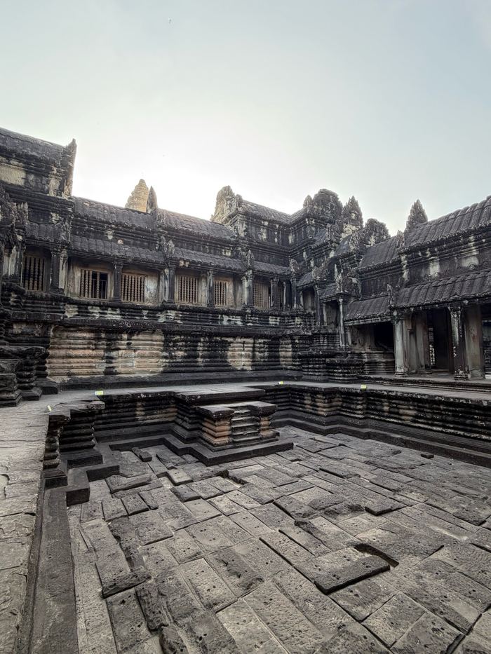 Inner galleries and a dry stone pool inside Angkor Wat