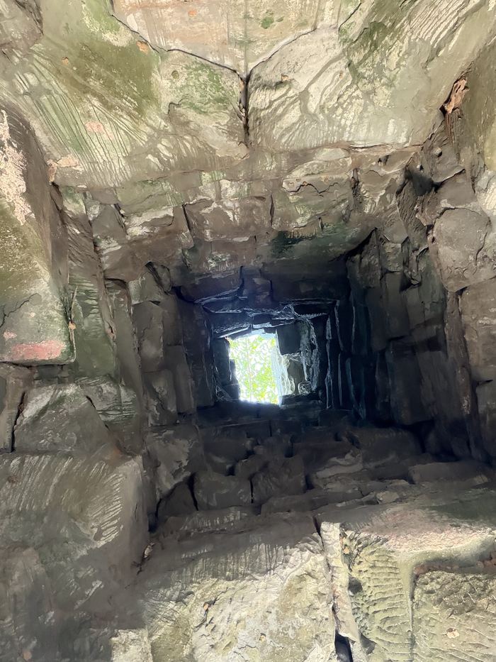 Light coming through a crumbling stone passage