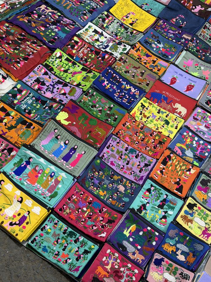 Colorful embroidered textiles laid out at the night market