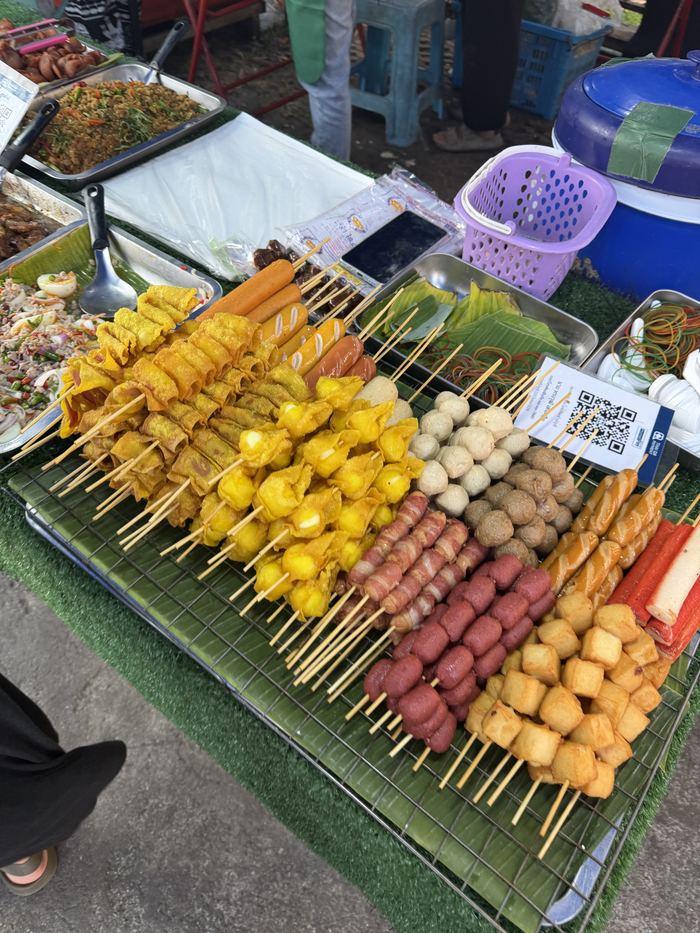 Fish ball and sausage skewers at a street food stall