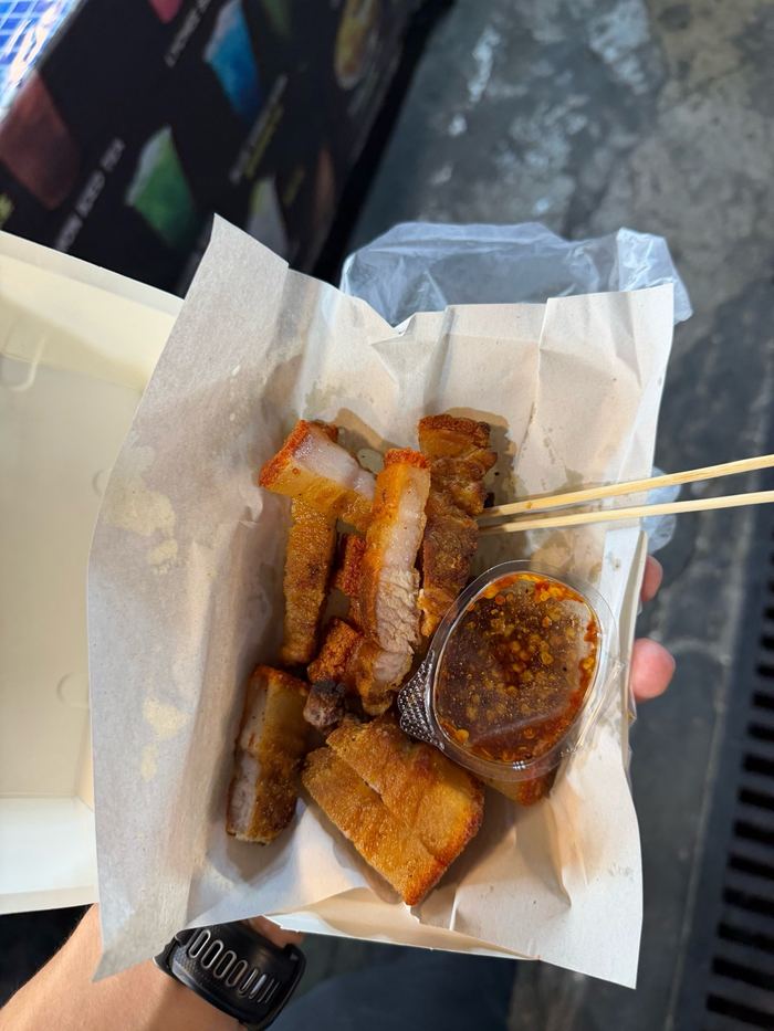 Crispy pork belly in a paper wrap