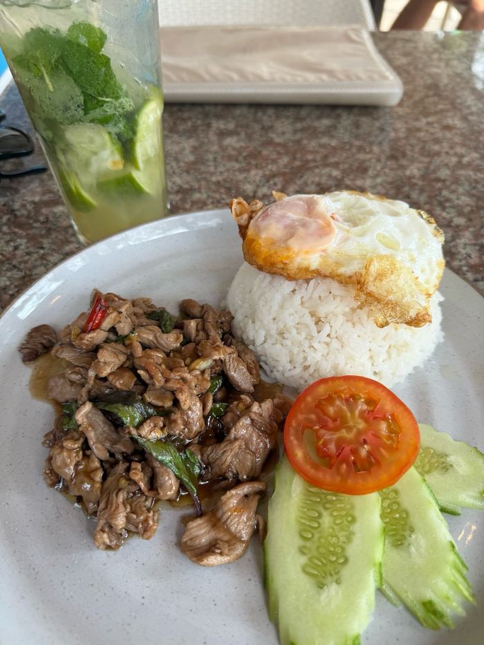 Pad kra pao with rice and a fried egg