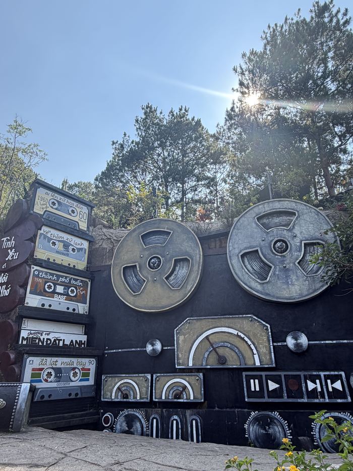 A wall sculpture of giant cassette tapes and a reel-to-reel