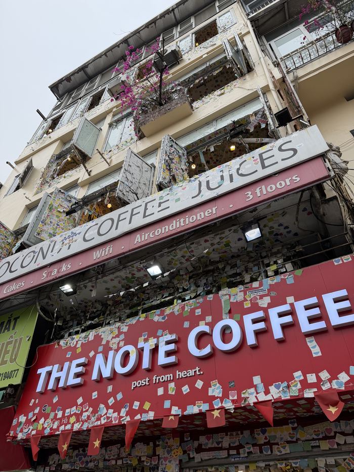 The front of The Note Coffee, covered in sticky notes