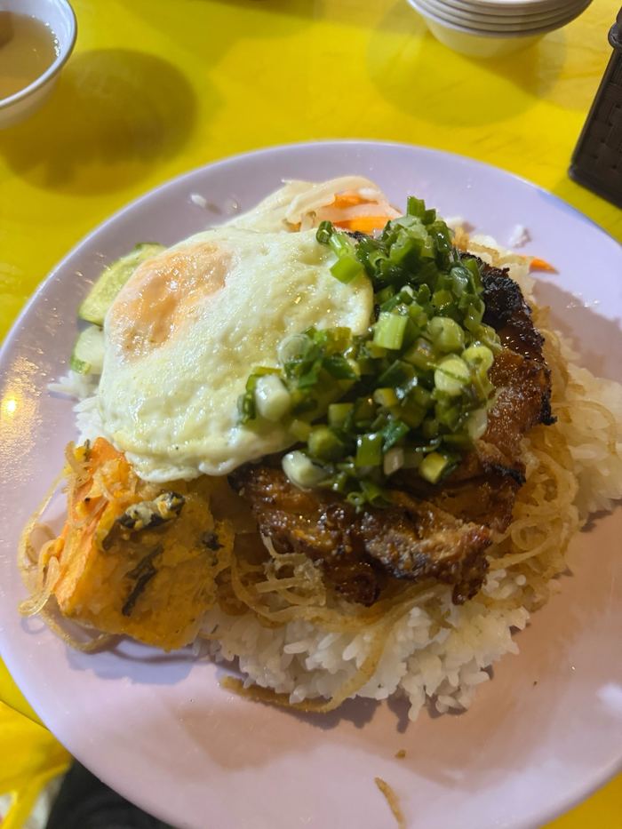 Broken rice with a pork chop and a fried egg