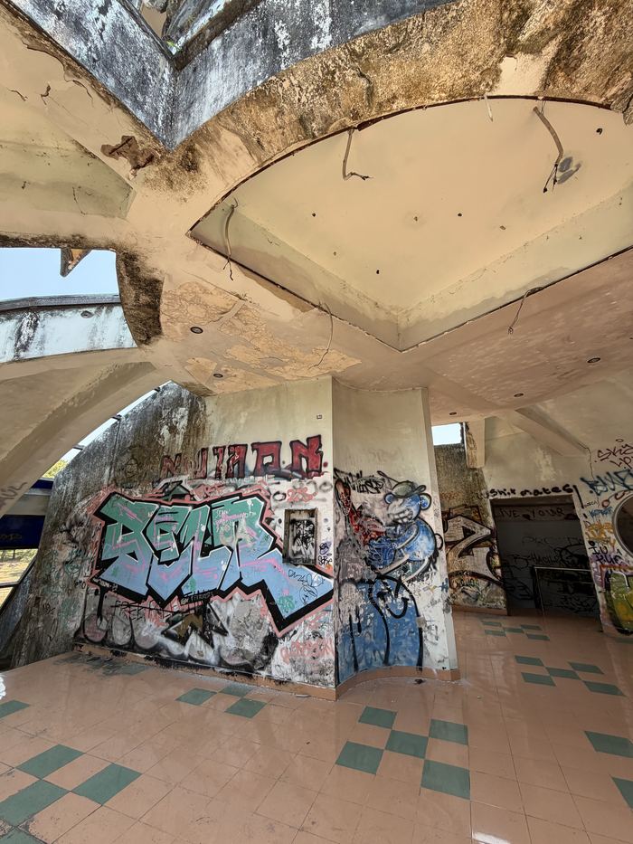 A graffiti-covered room inside the abandoned water park