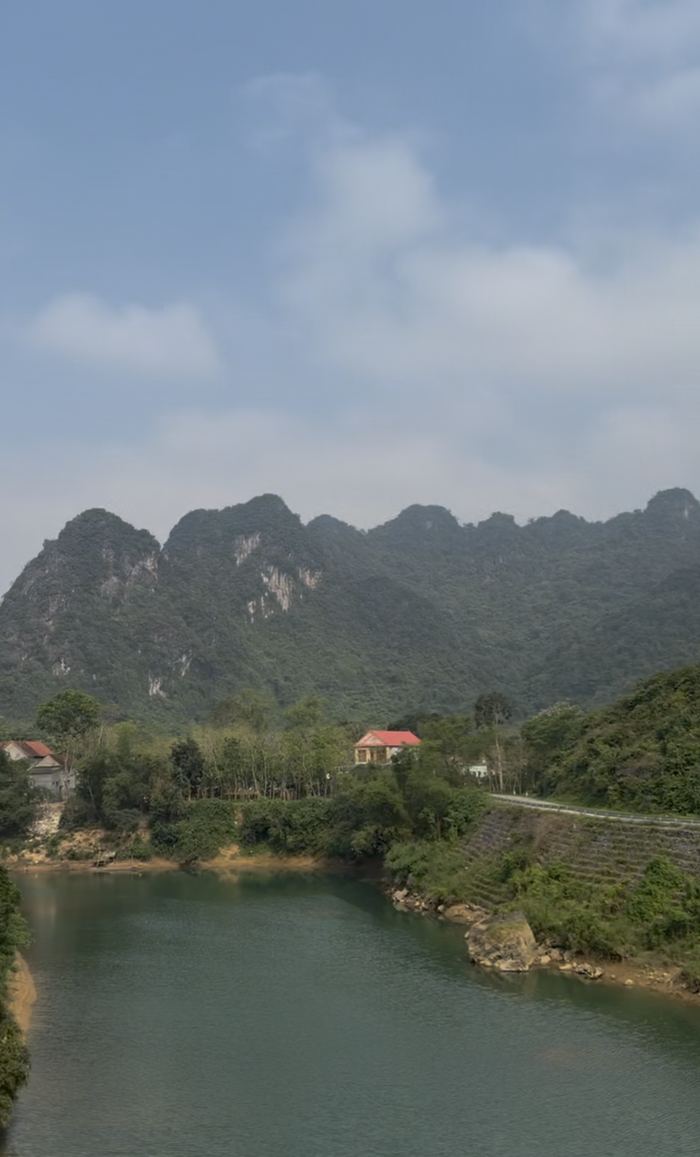 A river with jungle-covered mountains behind it