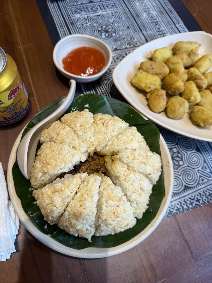 Horse meat with sticky rice and a plate of fried potatoes